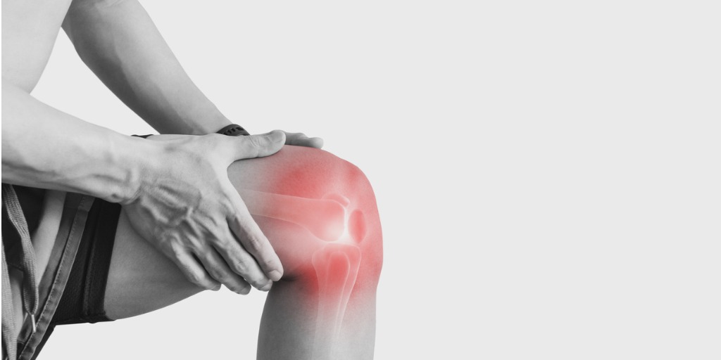 close up of man holding knee with illustration to show knee pain